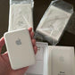 Apple iPhone battery pack with packaging on a dark surface