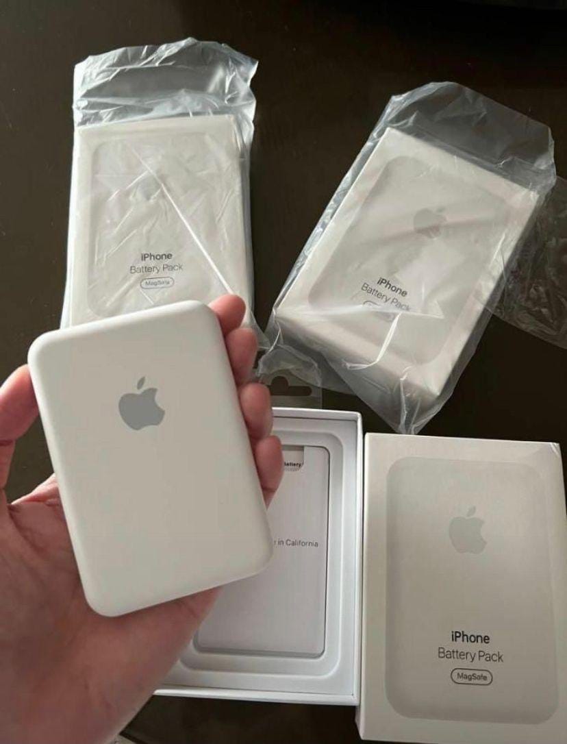 Apple iPhone battery pack with packaging on a dark surface