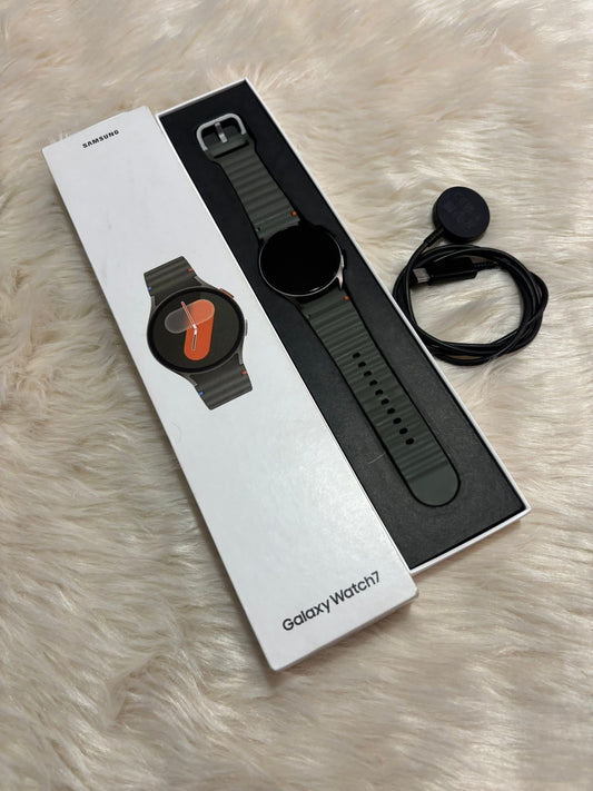  Watch 7 with packaging on a light brown surface