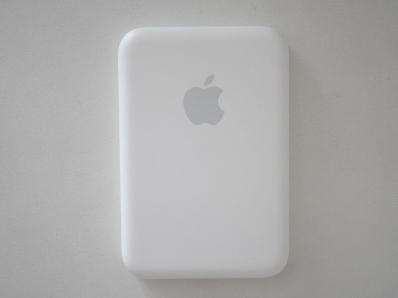 White Apple device on a gray background