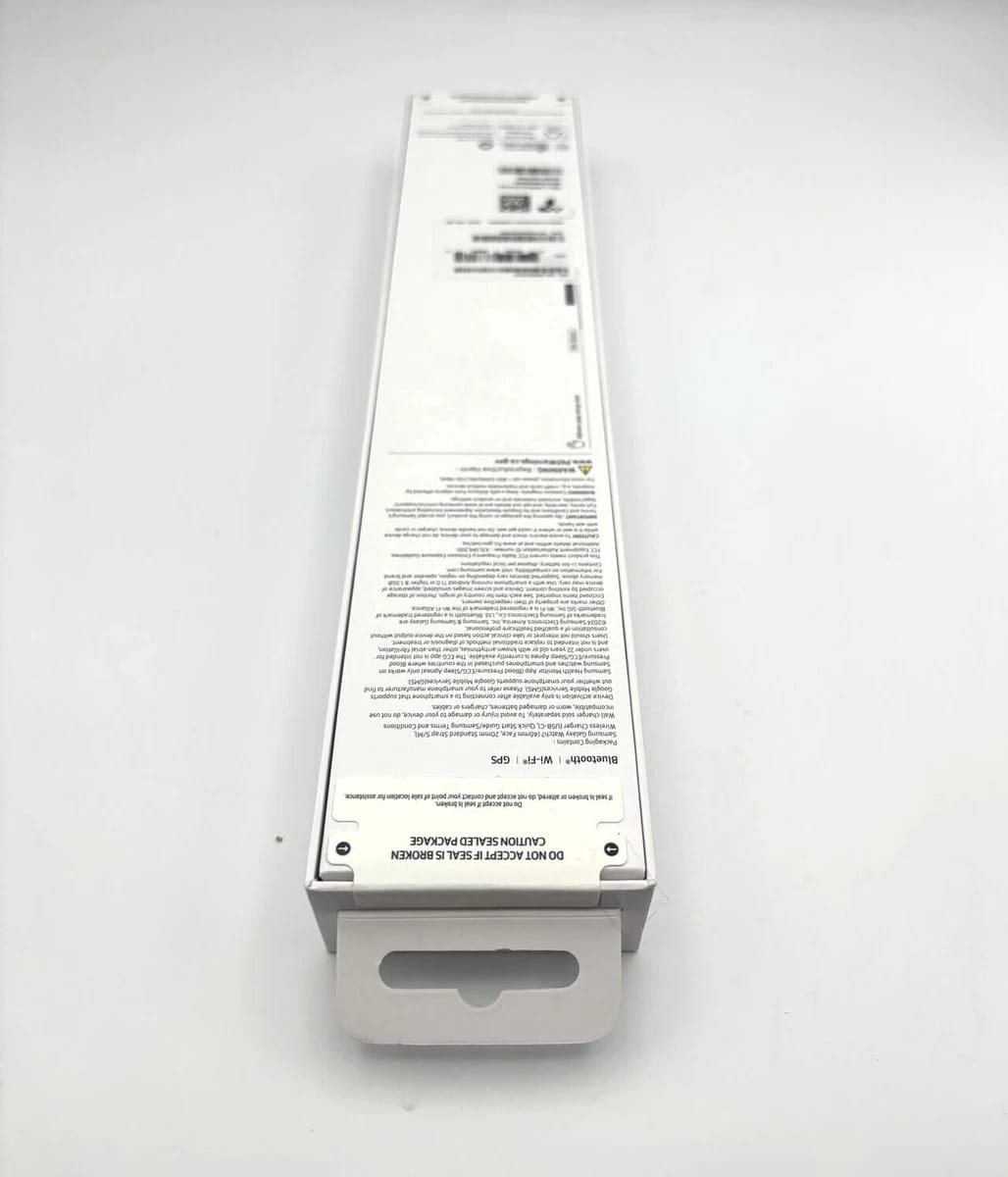 White electronic device packaging with text on a white background